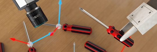 Eine IDS NXT Kamera und ein Roboterarm bei einer Smart Picking Anwendung.