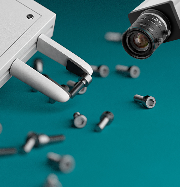 Nahaufnahme eines Roboterarms, der eine Schraube greift und einer IDS Kamera, die es filmt.