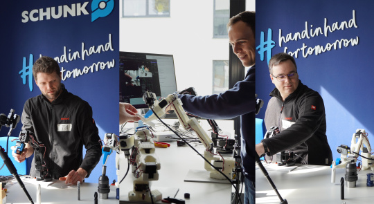 Hackathon Teilnehmer experimentieren mit uEye XC Kameras an Roboterarmen