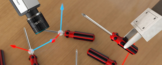 Eine IDS NXT Kamera und ein Roboterarm bei einer Smart Picking Anwendung.