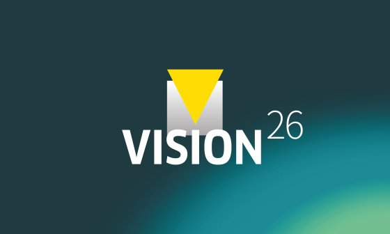 Grafik mit dem Schriftzug «VISION26» auf blaugrünem Hintergrund.